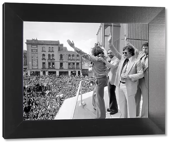 Alan Mullery Manager of Brighton FC - May1979 with players on a balcony