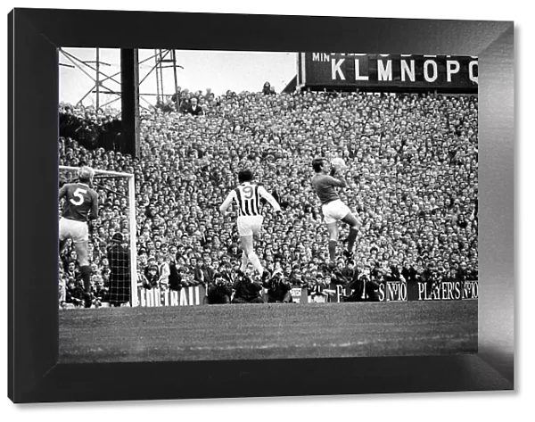 West Bromich Albion v Manchester United-Stepney collects as Astle of Albion flies in