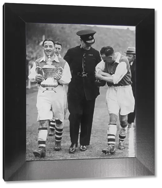 Alex James Arsenal Captain leaving the ground with the FA Cup after defeating Sheffield