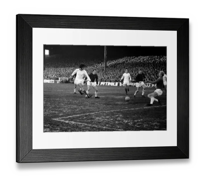 Framed Print : Burnley v Manchester United-George Best shoots at goal but it is pushed wide for a