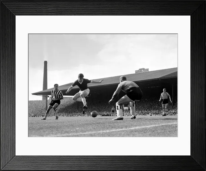 Framed Print : Manchester United forward Dennis Viollet shoots at goal past the Newcastle United Framed Print : Manchester United forward Dennis Viollet shoots at goal past the Newcastle United