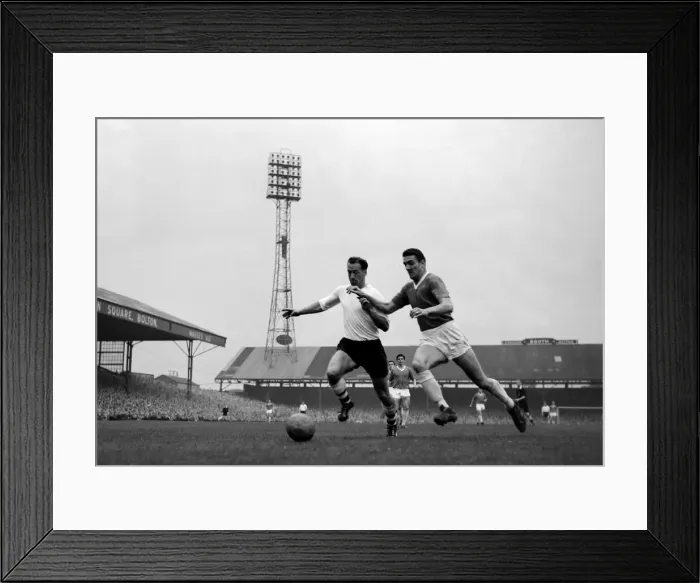 Framed Print : Nat lofthouse of Bolton Wanderers is challenged for the ball by Manchester United Framed Print : Nat lofthouse of Bolton Wanderers is challenged for the ball by Manchester United