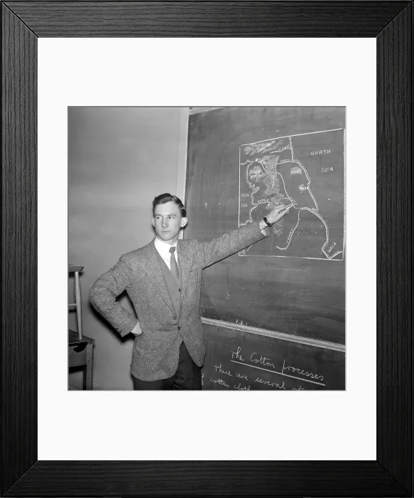 Framed Print : Warren Bradley of Manchester United writing on the chalk board in the classroom