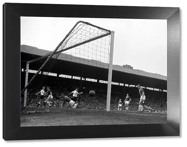 Manchester United goalkeeper Harry Gregg and defender Carolan watch a shot hit the back