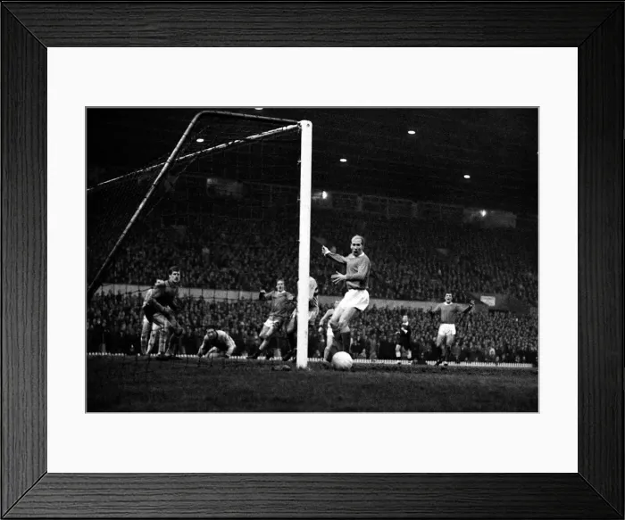 Framed Print : Bobby Charlton of Manchester United misses from close range during the match against West