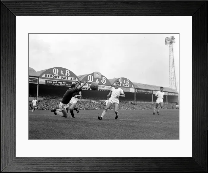 Framed Print : Manchester United goalkeeper Harry Gregg dives out for the ball watched by defender Bill Framed Print : Manchester United goalkeeper Harry Gregg dives out for the ball watched by defender Bill