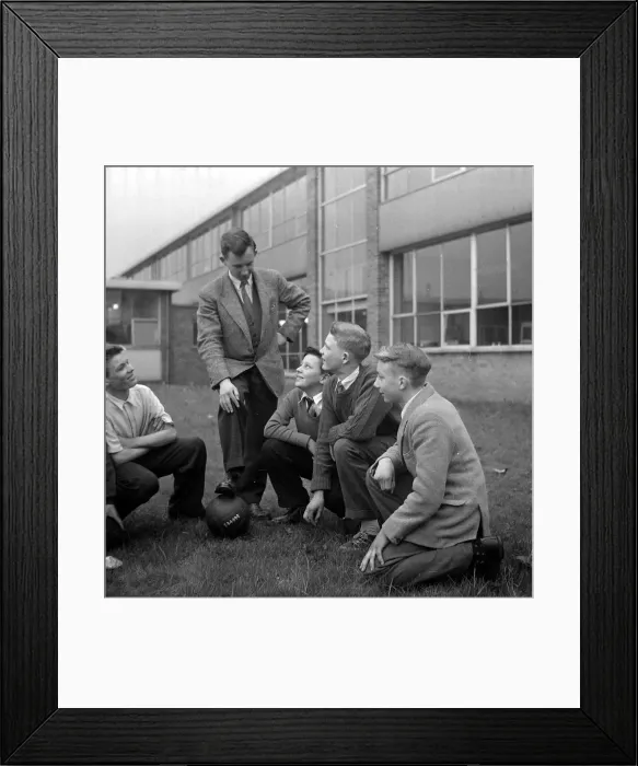 Framed Print : Warren Bradley of Manchester United with some of the boys at the school in Manchester Framed Print : Warren Bradley of Manchester United with some of the boys at the school in Manchester