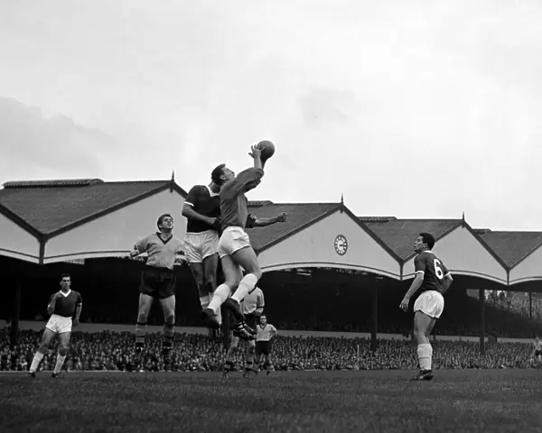 Manchester United goalkeeper Harry Gregg claims a high ball in his penalty area during