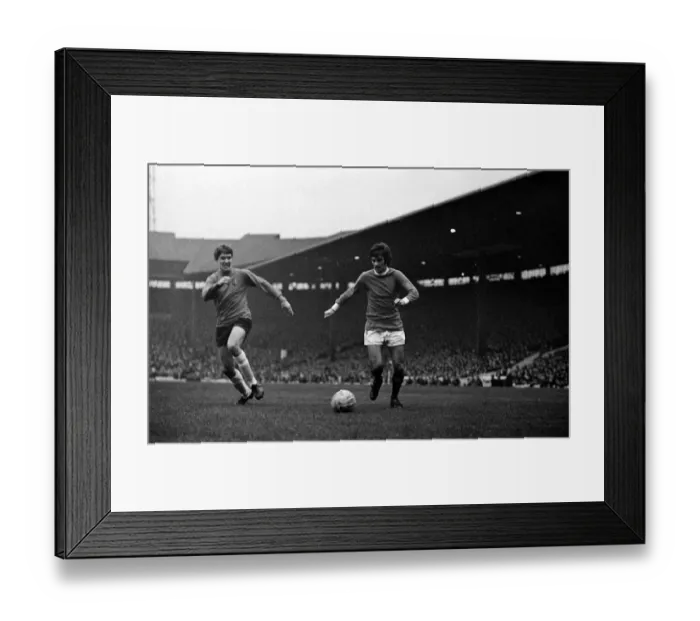 Framed Print : George Best of Manchester United on the ball watched by an Ipswich Town defender during Framed Print : George Best of Manchester United on the ball watched by an Ipswich Town defender during