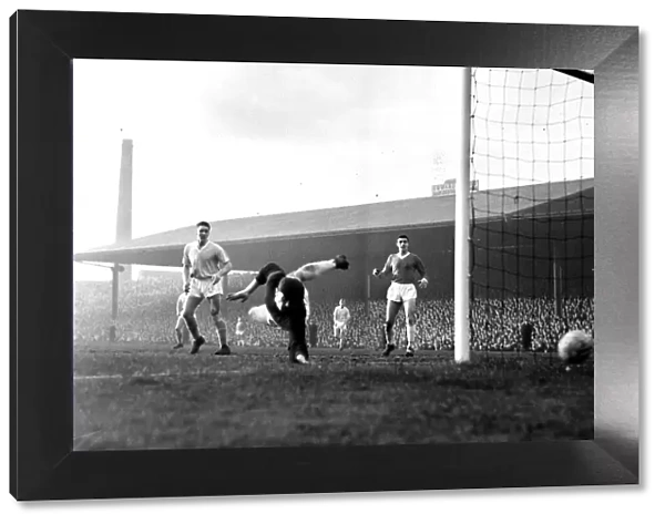 Manchester United goalkeper Harry Gregg saves again during a Manchester City attack in