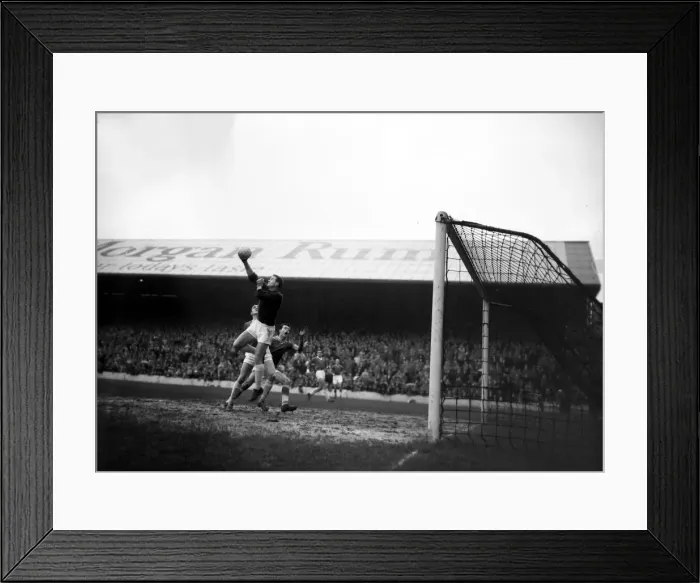 Framed Print : Manchester United goalkeeper Harry Gregg leaps high to catcha cross from the wing from in Framed Print : Manchester United goalkeeper Harry Gregg leaps high to catcha cross from the wing from in