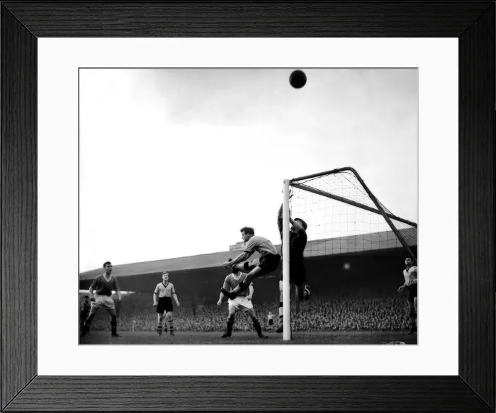 Framed Print : Harris (Wolves left back) and Finlayson (goalkeeper) both go up for header from taylor Framed Print : Harris (Wolves left back) and Finlayson (goalkeeper) both go up for header from taylor