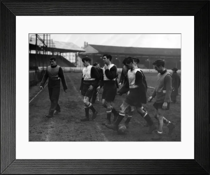 Framed Print : Billy Foulkes (left) leaves the field with some of the Babes who will probably be playing Framed Print : Billy Foulkes (left) leaves the field with some of the Babes who will probably be playing