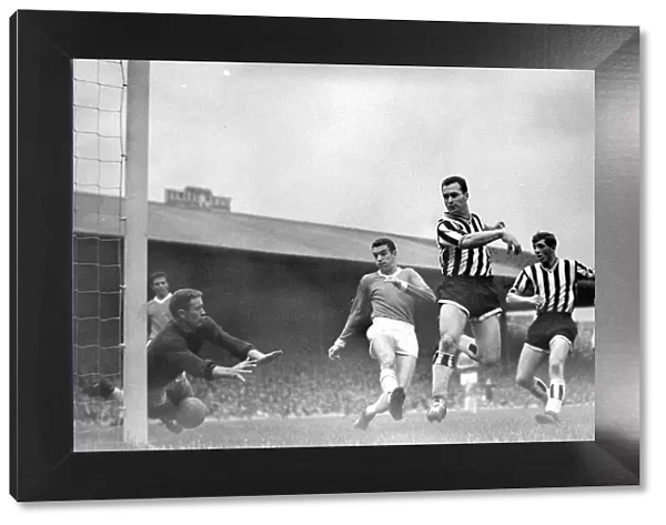 Manchester United versus Newcastle-Harry Greg dives at the ball as United are lucky not