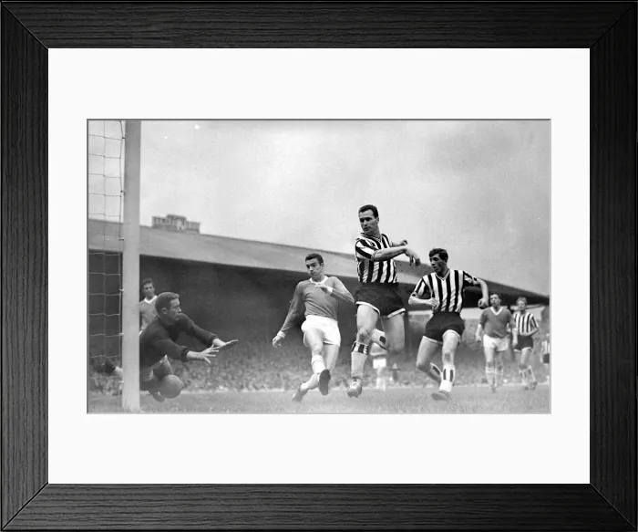 Framed Print : Manchester United versus Newcastle-Harry Greg dives at the ball as United are lucky not