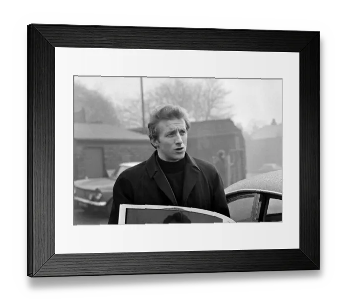 Framed Print : Manchester United player Denis Law arrives for training February 1969 Framed Print : Manchester United player Denis Law arrives for training February 1969
