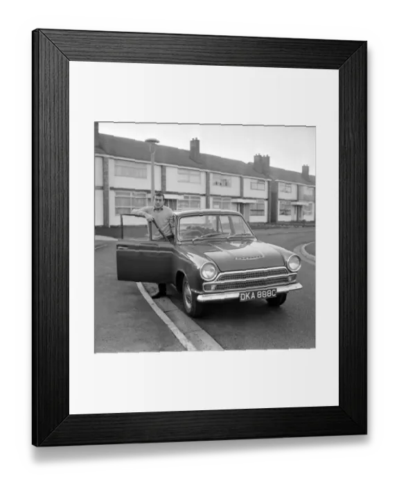 Framed Print : Liverpool footballer Ian St. John with his new Ford Cortina in Liverpool Framed Print : Liverpool footballer Ian St. John with his new Ford Cortina in Liverpool