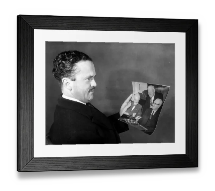 Framed Print : John Cobbold Dec 1959 Ipswich FC Chairman looks at a picture of the FA cup draw which put Framed Print : John Cobbold Dec 1959 Ipswich FC Chairman looks at a picture of the FA cup draw which put