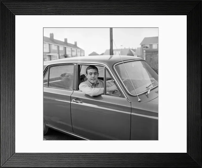 Framed Print : Liverpool footballer Ian St. John with his new Ford Cortina in Liverpool Framed Print : Liverpool footballer Ian St. John with his new Ford Cortina in Liverpool