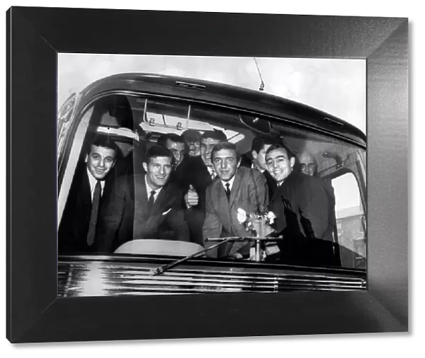 Liverpool football players, full of high spirits as they board coach for cup tie against