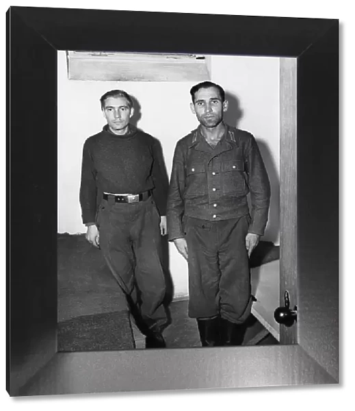 Engelbert Nadermayer (right) who was formerly in charge of the notorious crematorium at Dachau, shown in his cell alongside a former SS trooper who is also on the list of war criminals to be tried. 20th September 1945