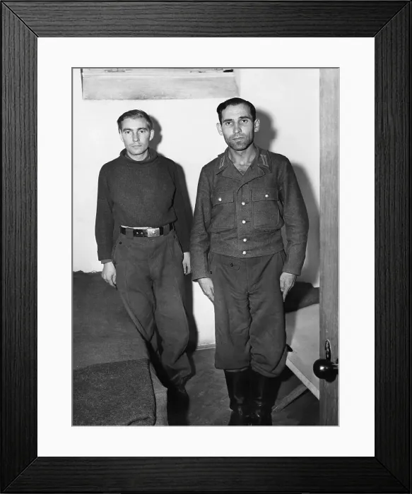 Framed Print : Engelbert Nadermayer (right) who was formerly in charge of the notorious crematorium at Dachau, shown in his cell alongside a former SS trooper who is also on the list of war criminals to be tried. 20th September 1945 Framed Print : Engelbert Nadermayer (right) who was formerly in charge of the notorious crematorium at Dachau, shown in his cell alongside a former SS trooper who is also on the list of war criminals to be tried. 20th September 1945