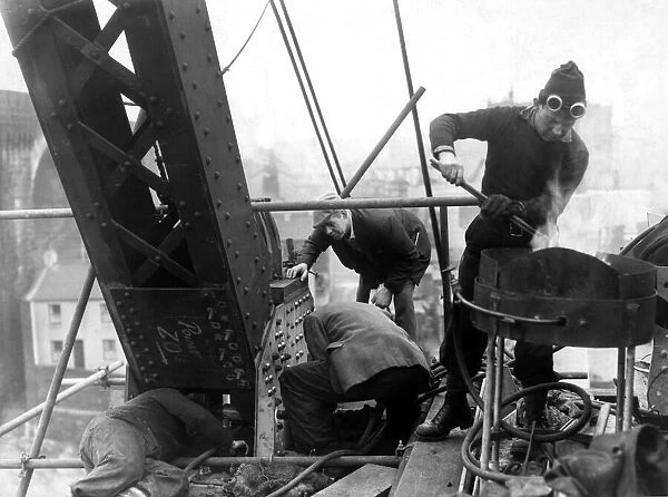 00608466 Foreman rivetter, Archie Ashcroft, with workmen at work on the new Silver