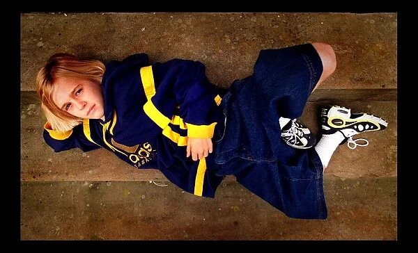10 year old pop star Aaron Carter May 1998 lying on stairs