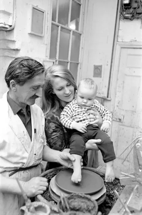 Framed Print : 11 month old Roy Crosland has his footprint cast by making a imprint on the wet clay