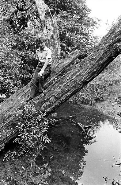 11-year-old John Domigan, of Bell Green, Coventry, after being rescued from a tree lying