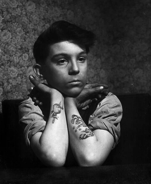 14-year-old Arthur Waterworth of Droylsden shows off his tattooed forearms