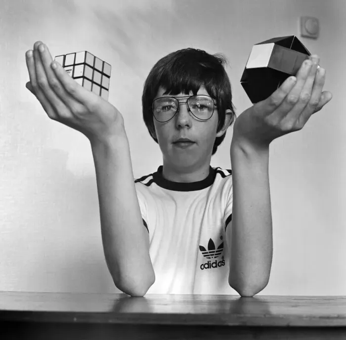 Framed Print : 14 year old Terence Wilson of Deepdale near Preston, with his Rubik cube and snake Framed Print : 14 year old Terence Wilson of Deepdale near Preston, with his Rubik cube and snake