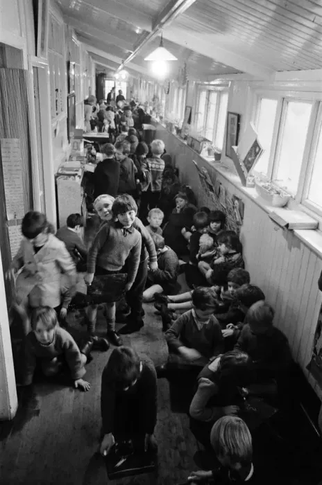 Framed Print : Some of the 180 children play in the small corridor at Sacred Heart RC school, Gorton Framed Print : Some of the 180 children play in the small corridor at Sacred Heart RC school, Gorton
