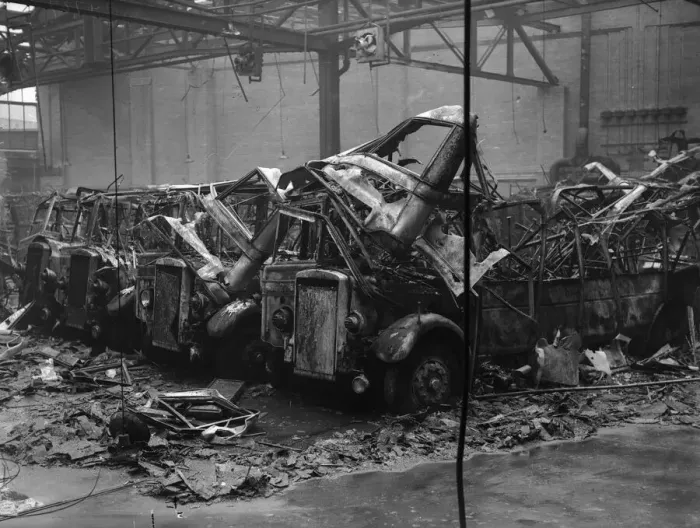 Framed Print : 19 burnt out and four partly burnt out buses sit in the remains of Hockley bus depot