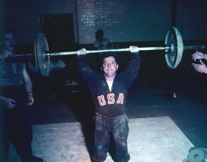Framed Print : 1948 London Olympics in Colour A member of the USA weightlifting team seen here