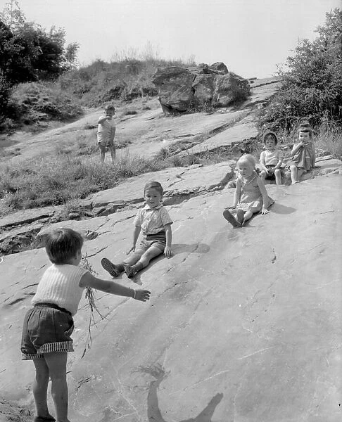 1950s, shows children enjoying themselves (just as they still do