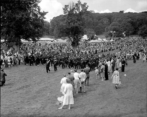 1950s, shows a massed pipe band of the Gurkhas entertaining visitors to the Goram Fair