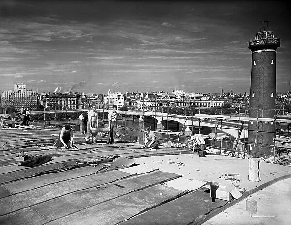 1951 South Bank Exhibition Site. Plasterers at work preparing roof of the Concert Hall