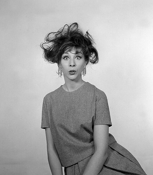 1960s Fashion Hair Styles December 1960 Woman pulling a bemused  /  shocked facial