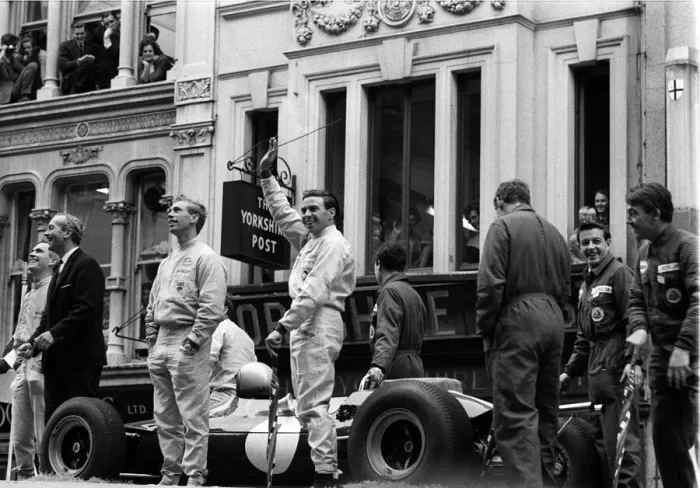 Framed Print : 1964 Racing Driver Jim Clark waves to the Crowd Framed Print : 1964 Racing Driver Jim Clark waves to the Crowd