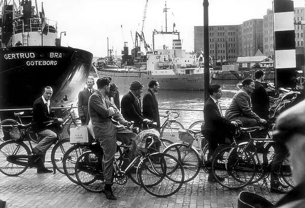 1964, shows Bristol City Docks (Floating Harbour) workers making their way home
