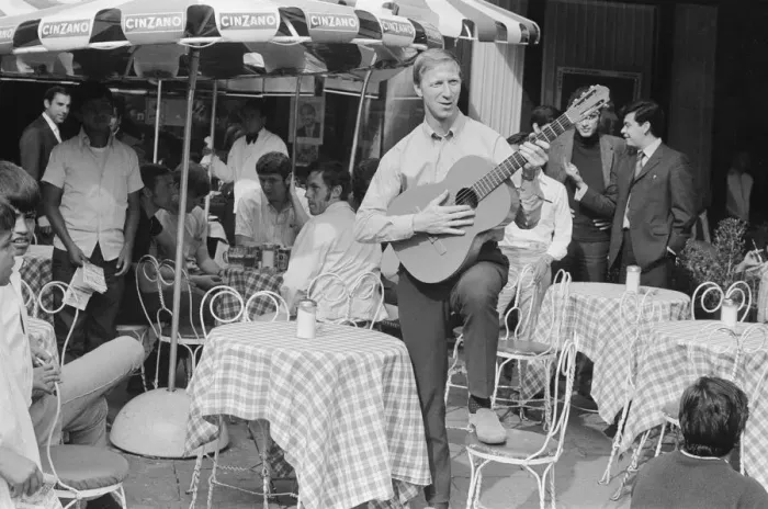 Framed Print : 1970 World Cup Finals in Mexico. England defender Jack Charlton strumming a guitar