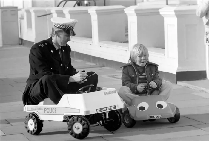 Framed Print : 1975 Brighton Toy Fair. Police cut backs mean this traffic cop can only pull over Framed Print : 1975 Brighton Toy Fair. Police cut backs mean this traffic cop can only pull over