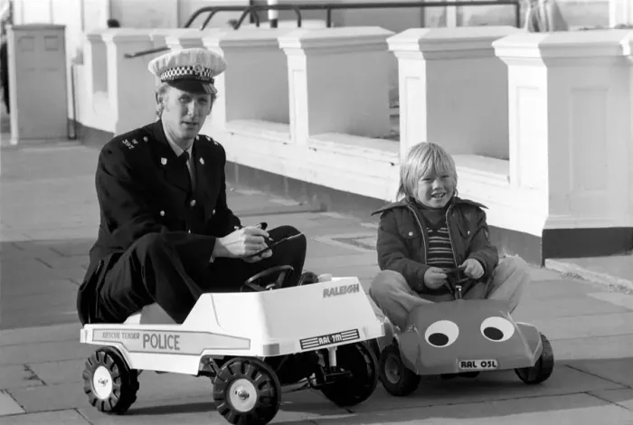 Framed Print : 1975 Brighton Toy Fair. Police cut backs mean this traffic cop can only pull over Framed Print : 1975 Brighton Toy Fair. Police cut backs mean this traffic cop can only pull over