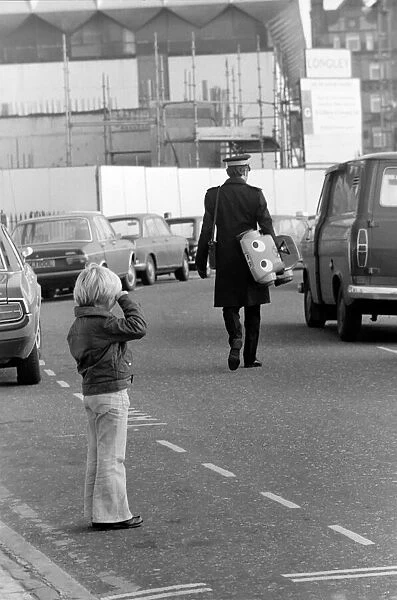 1975 Brighton Toy Fair. Small boy cries as Traffic Warden confiscate toy pedal car for