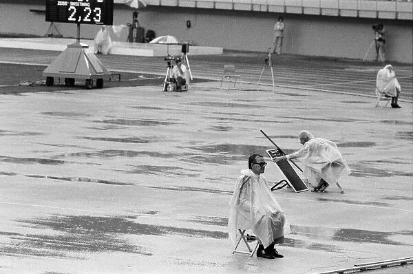 The 1976 Summer Olympics in Montreal, Canada. Pictured, track officials under plastic
