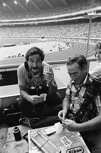 The 1976 Summer Olympics in Montreal, Canada. Pictured, press photographers playing cards