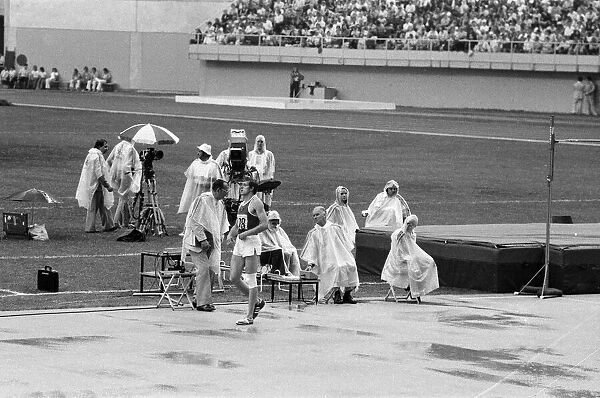 The 1976 Summer Olympics in Montreal, Canada. Pictured, track officials under plastic