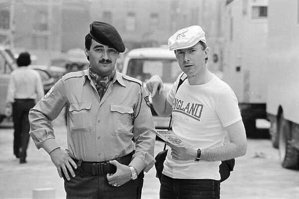 1982 World Cup Finals in Spain. An English fan poses with a Spanish policeman