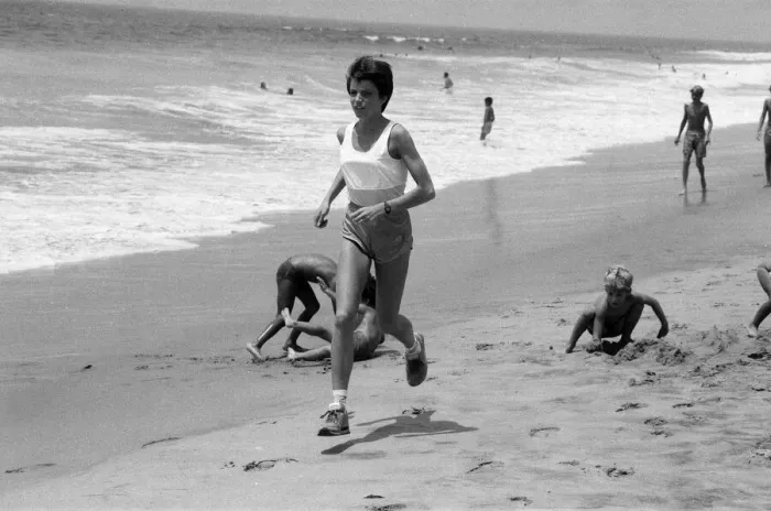 Framed Print : The 1984 Summer Olympics in Los Angeles. Wendy Sly running on Manhattan Beach, California Framed Print : The 1984 Summer Olympics in Los Angeles. Wendy Sly running on Manhattan Beach, California